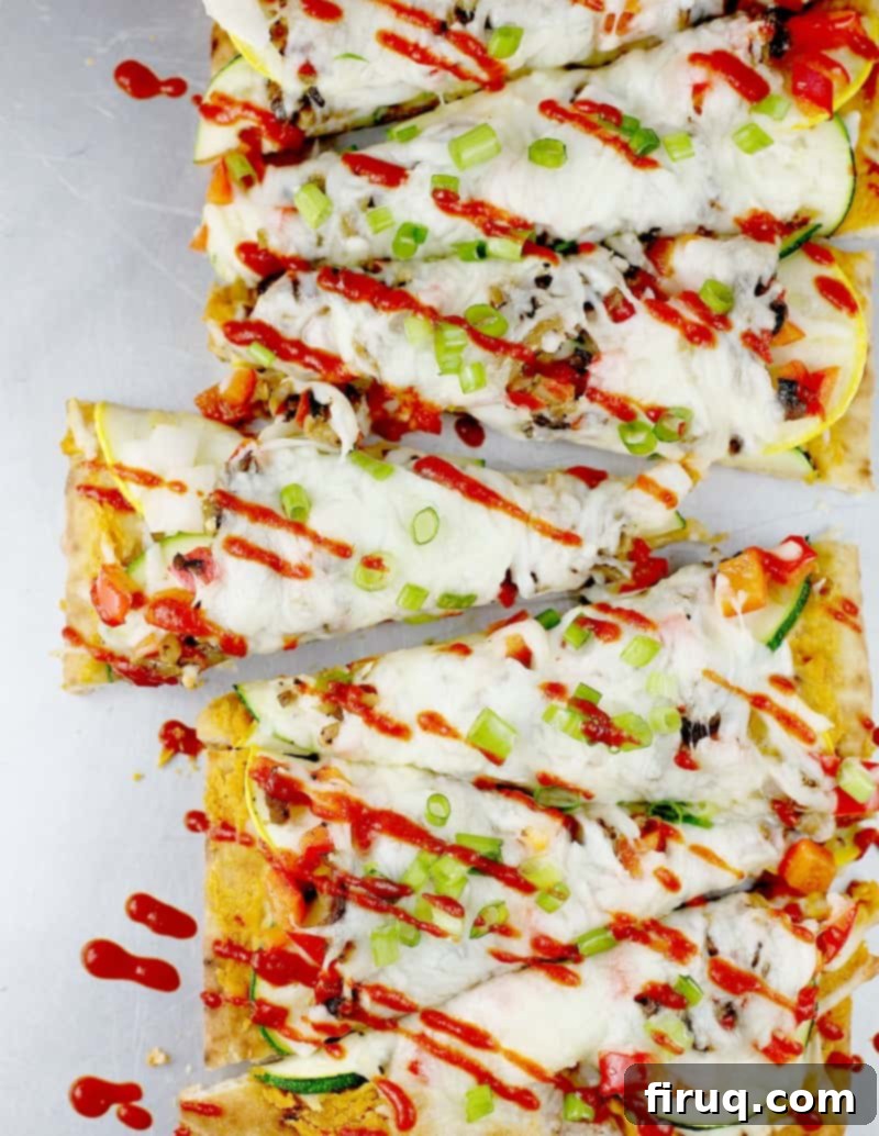 Siam Spice Veggie Flatbread 5 Layering cheese and thinly sliced vegetables on the flatbread