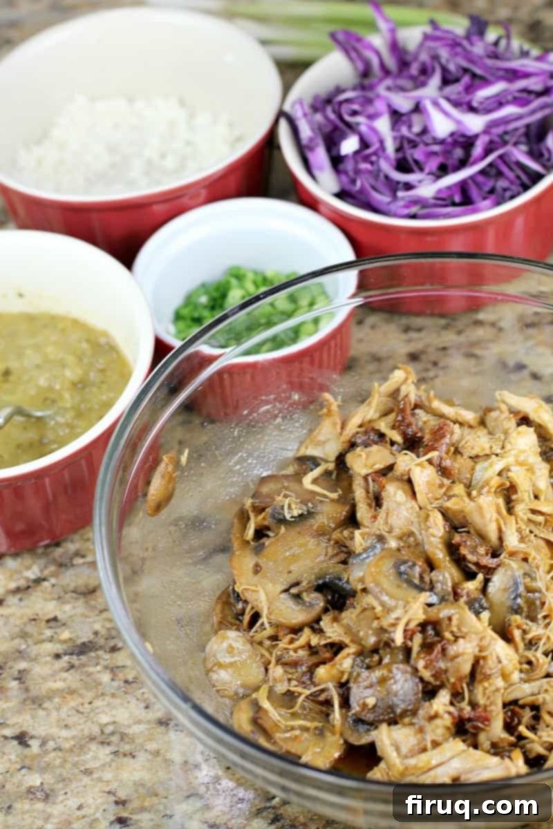 Ultimate Instant Pot Chicken Tacos 5 Assembled Instant Pot Chicken Tacos with red cabbage and queso fresco