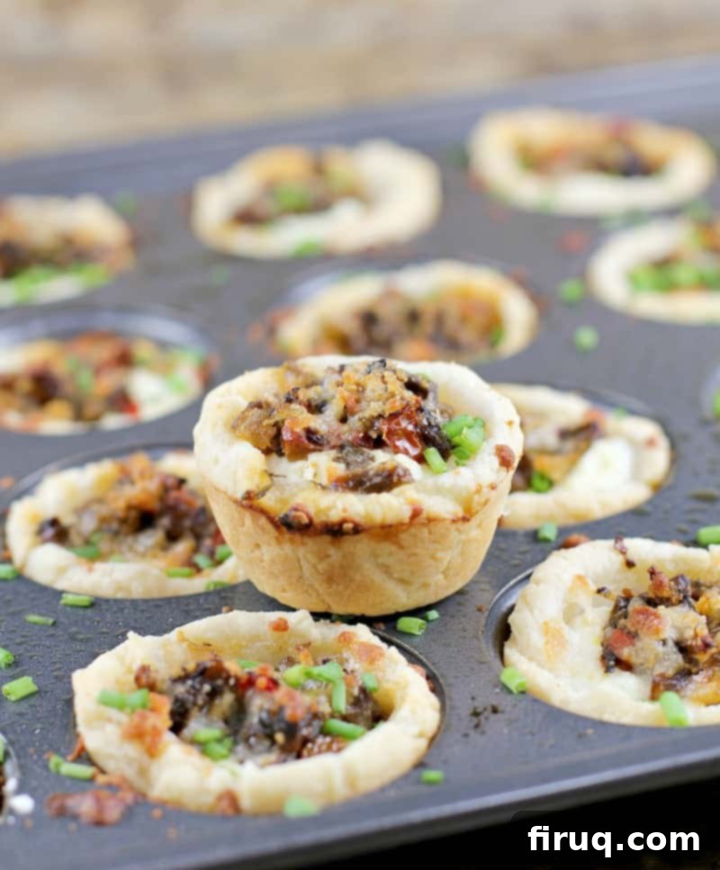 Savory Tuscan Mushroom Ricotta Tartlets 3 Platter of freshly baked Tuscan Mushroom Ricotta Mini Tarts, ready to serve at a party