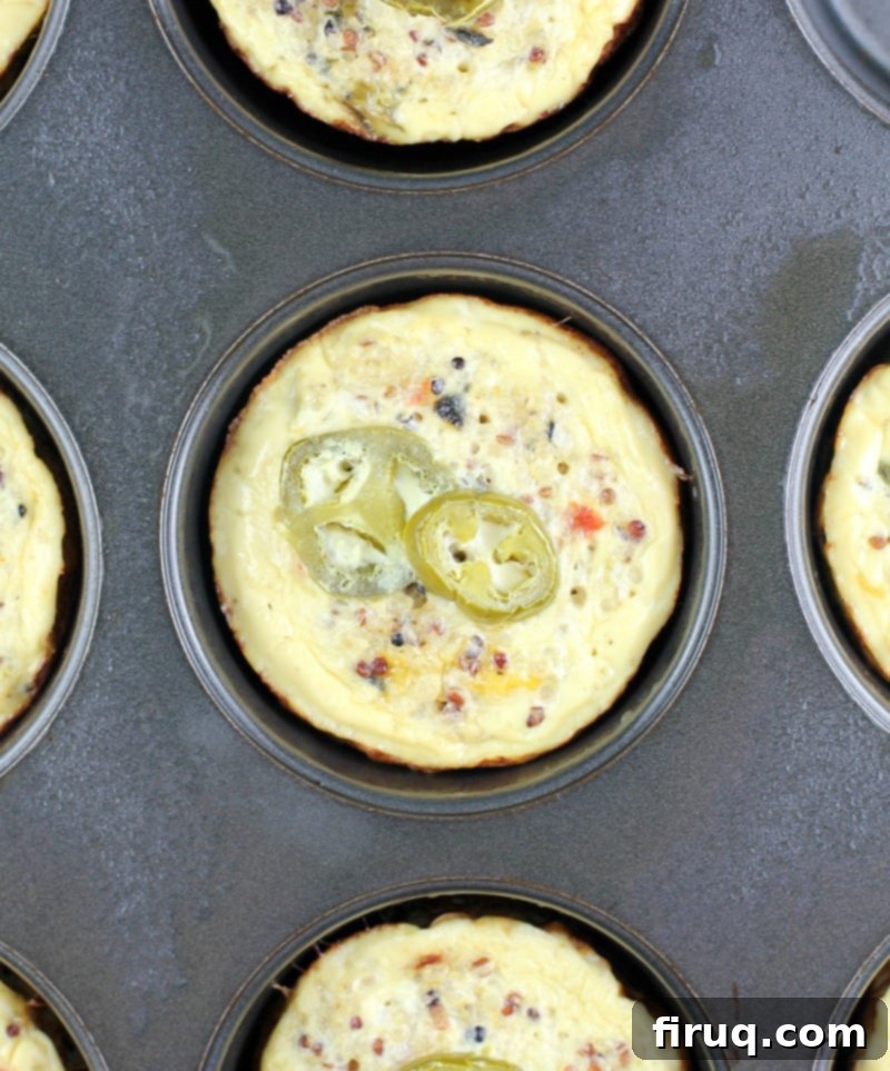 Zesty Southwest Quinoa Egg Muffins 3 Southwest Quinoa Egg Muffins in a bowl with hot sauce