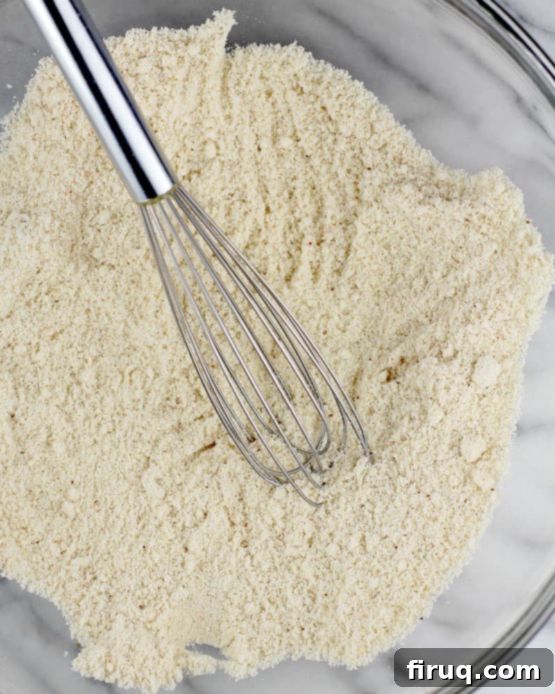 Guilt-Free Cheddar Bay Biscuits 4 Fine almond flour in a clear glass bowl, ready for baking