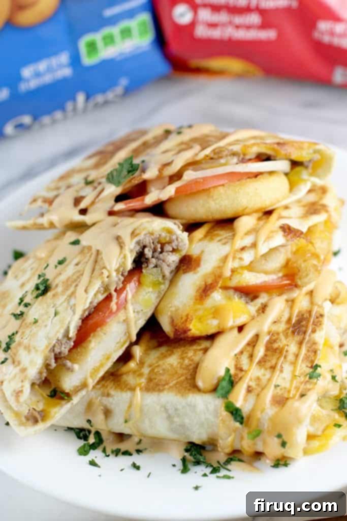 Loaded Burger Fry Quesadilla 12 4 halves of quesadilla stacked, side view to show filling. top 2 pieces have the mashed potato shapes; bottom two have crinkle fries