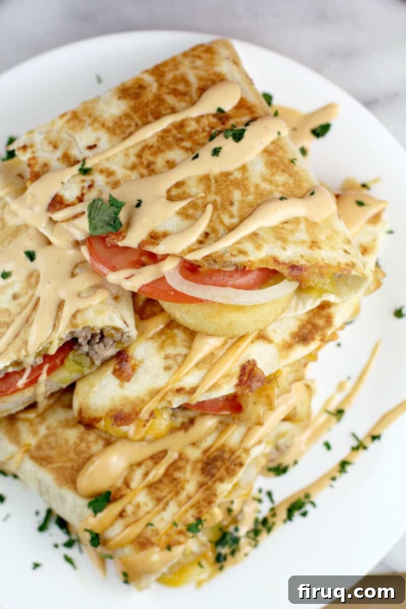 Loaded Burger Fry Quesadilla 3 top view of finished quesadilla, four pieces stacked