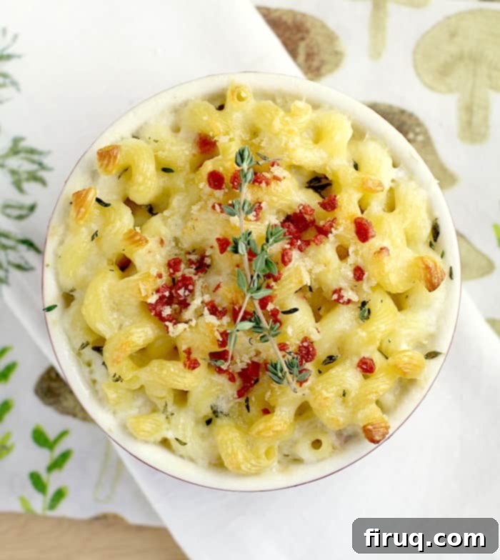 Gourmet White Wine Mac and Cheese 2 top down view of white wine mac and cheese in a small crock topped with bacon and thyme