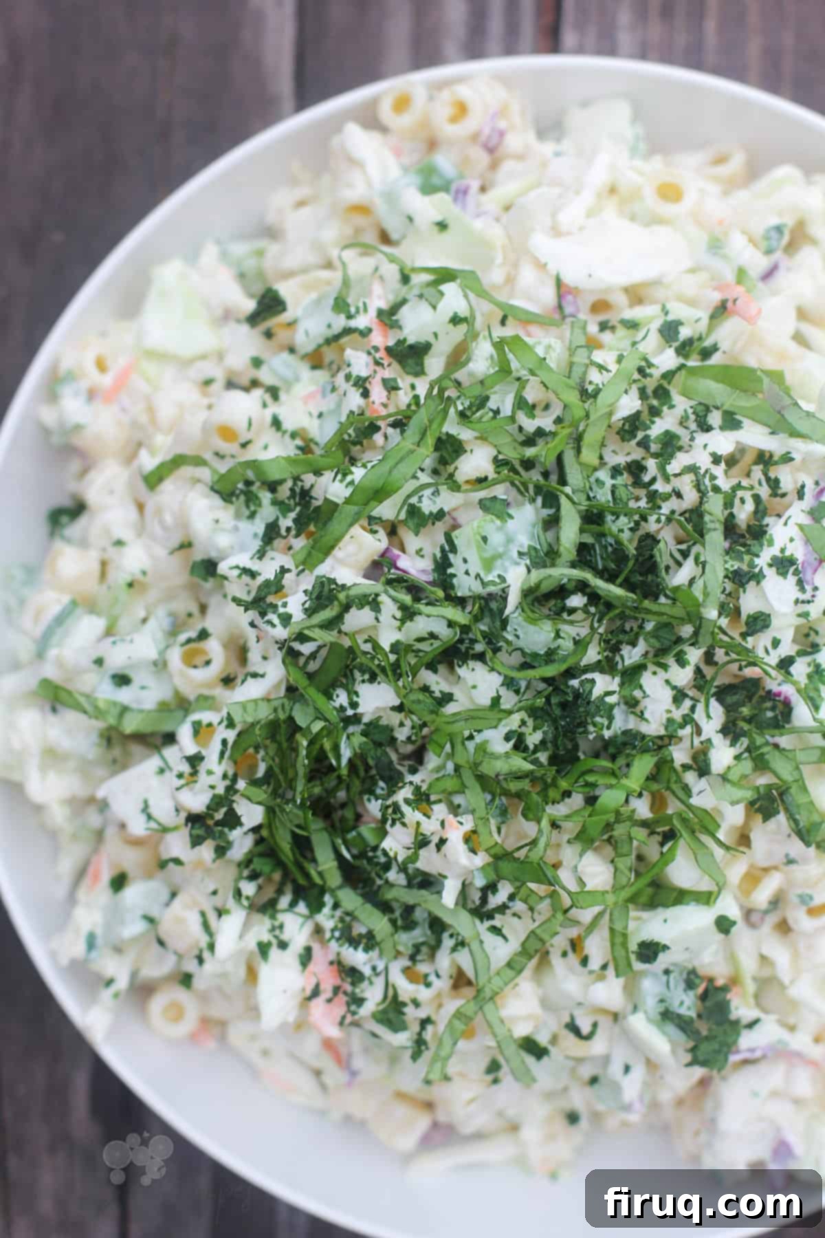 Creamy Slaw Macaroni Medley 6 prepared salad in white bowl on weathered wood background