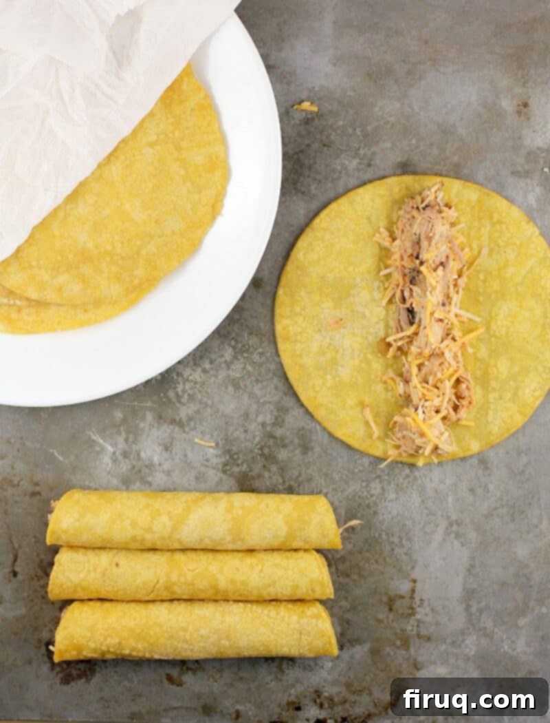 Crispy Air Fryer Pulled Pork Taquitos 6 top down view of taquito assembly process with pulled pork filling