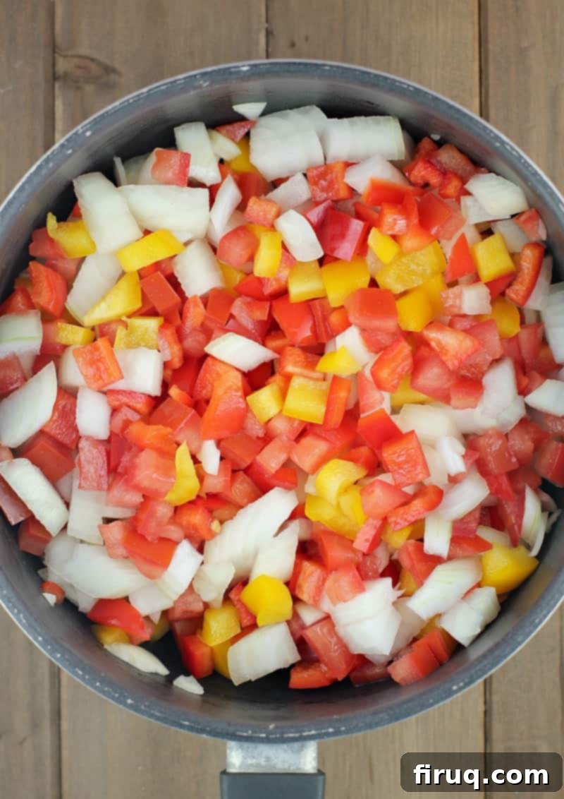 Air Fryer Hot Dogs: Crispy Perfection with Sweet Pepper Relish 5 chopped relish ingredients in a black saucepan prior to cooking