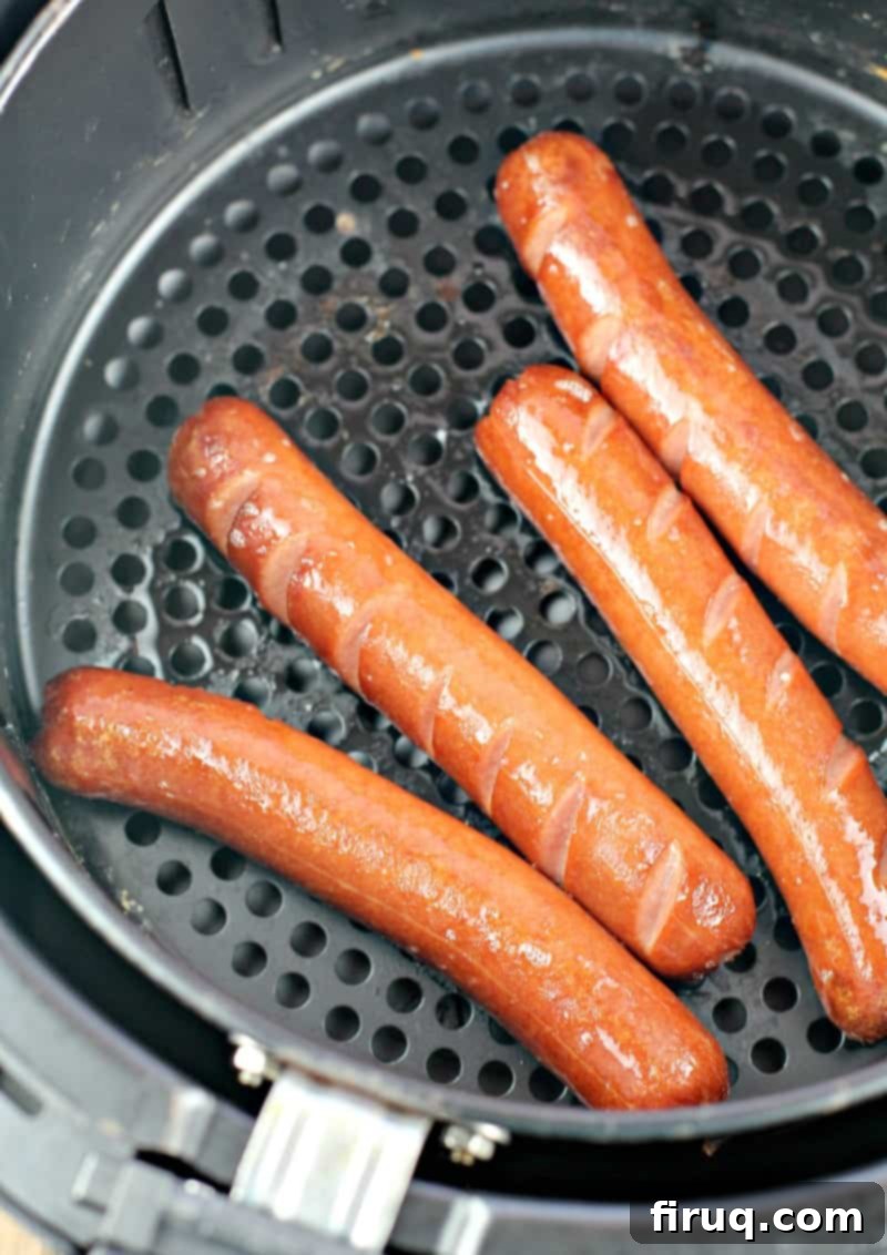 Air Fryer Hot Dogs: Crispy Perfection with Sweet Pepper Relish 7 four cooked hot dogs in an air fryer