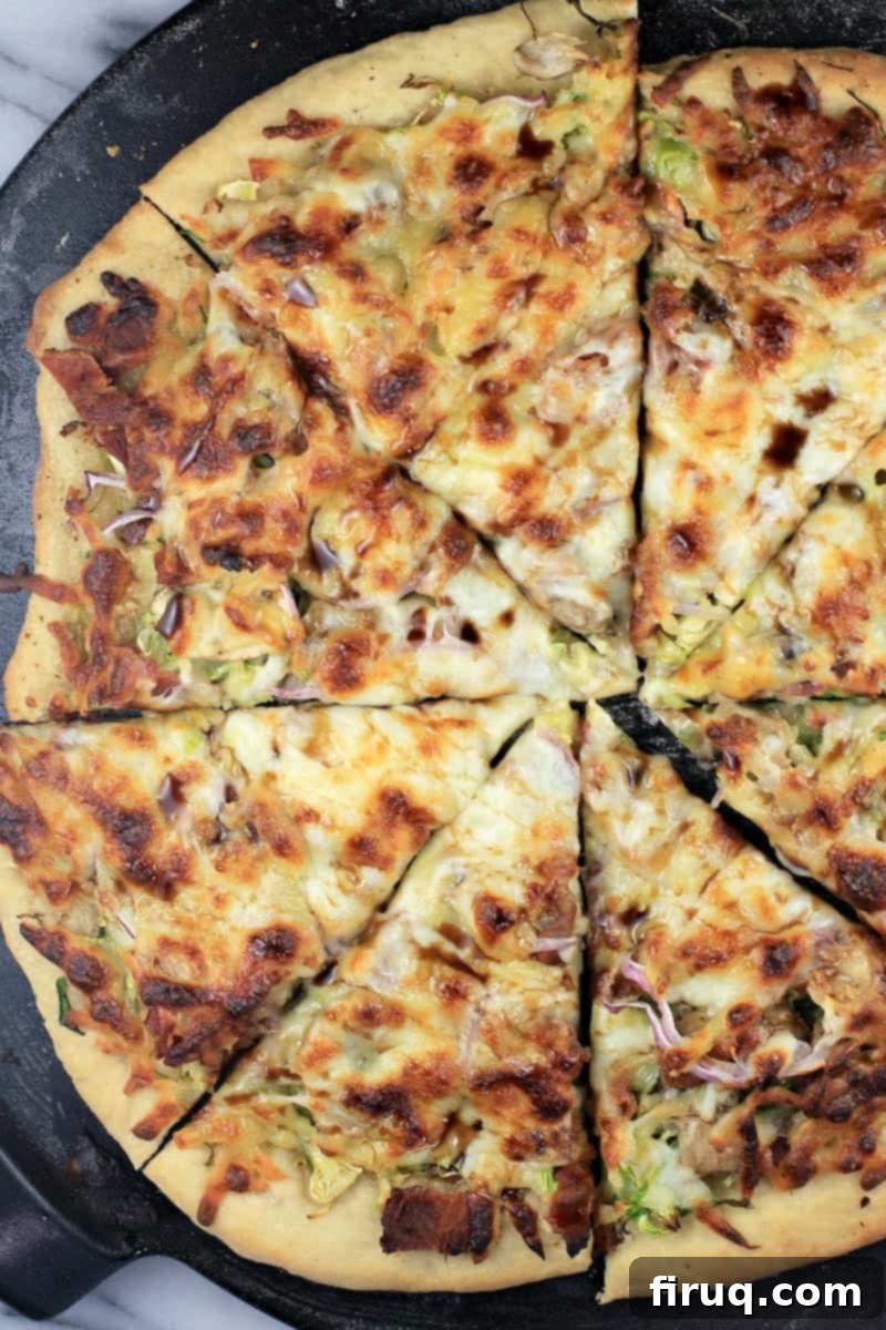 Crispy Bacon & Roasted Brussels Pizza 3 top down view of whole pizza, sliced