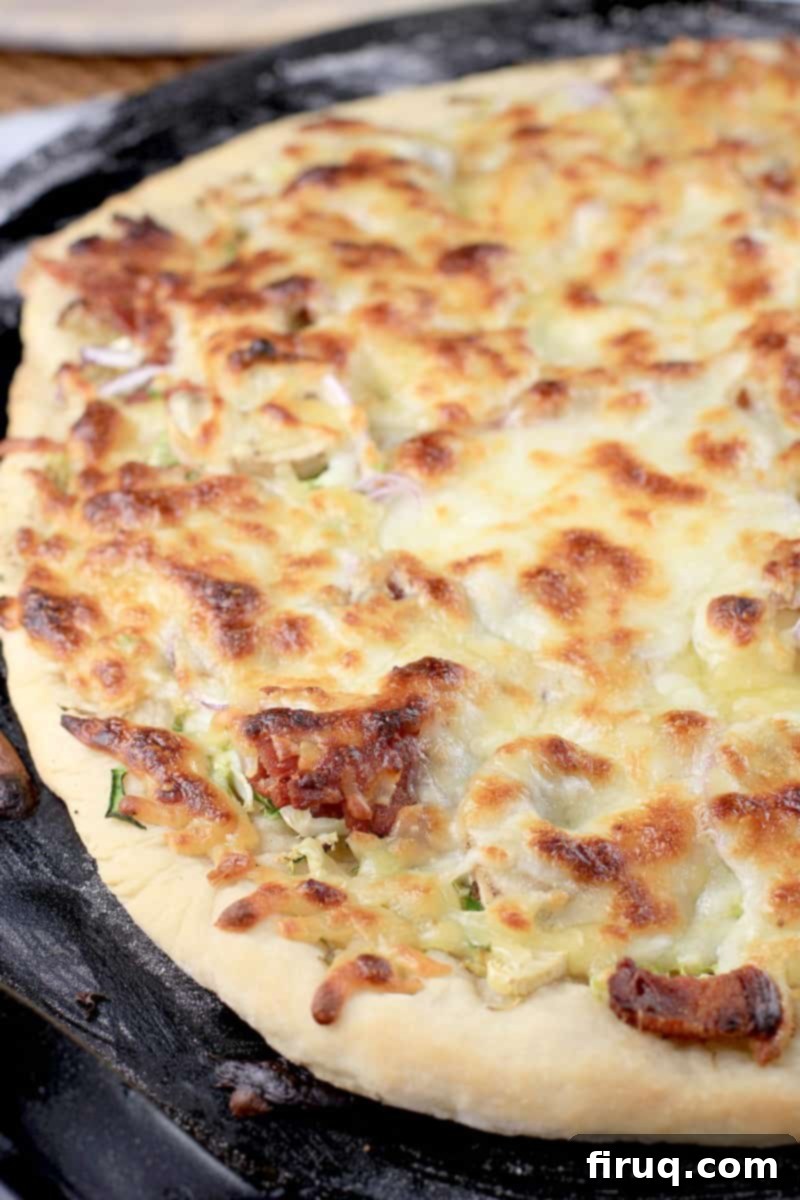Crispy Bacon & Roasted Brussels Pizza 7 cooked, whole pizza prior to slicing