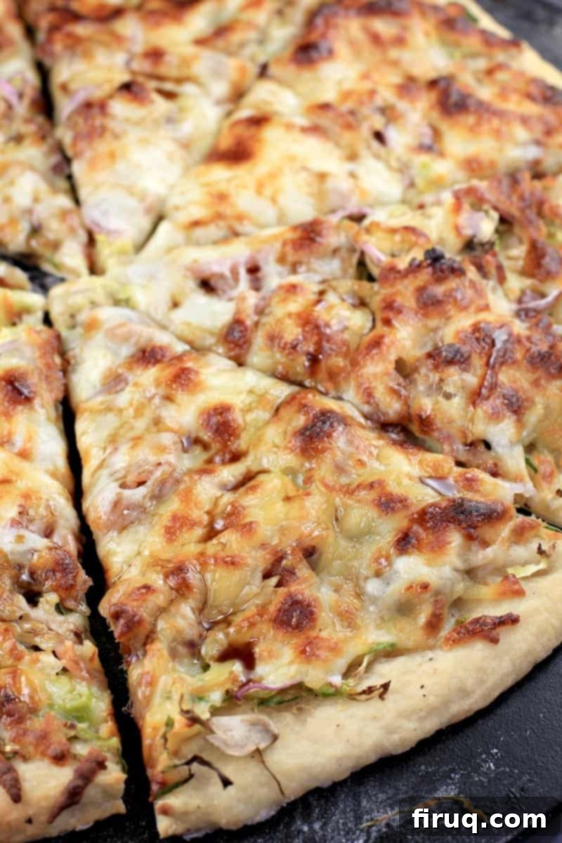 Crispy Bacon & Roasted Brussels Pizza 8 sliced pizza on pizza stone