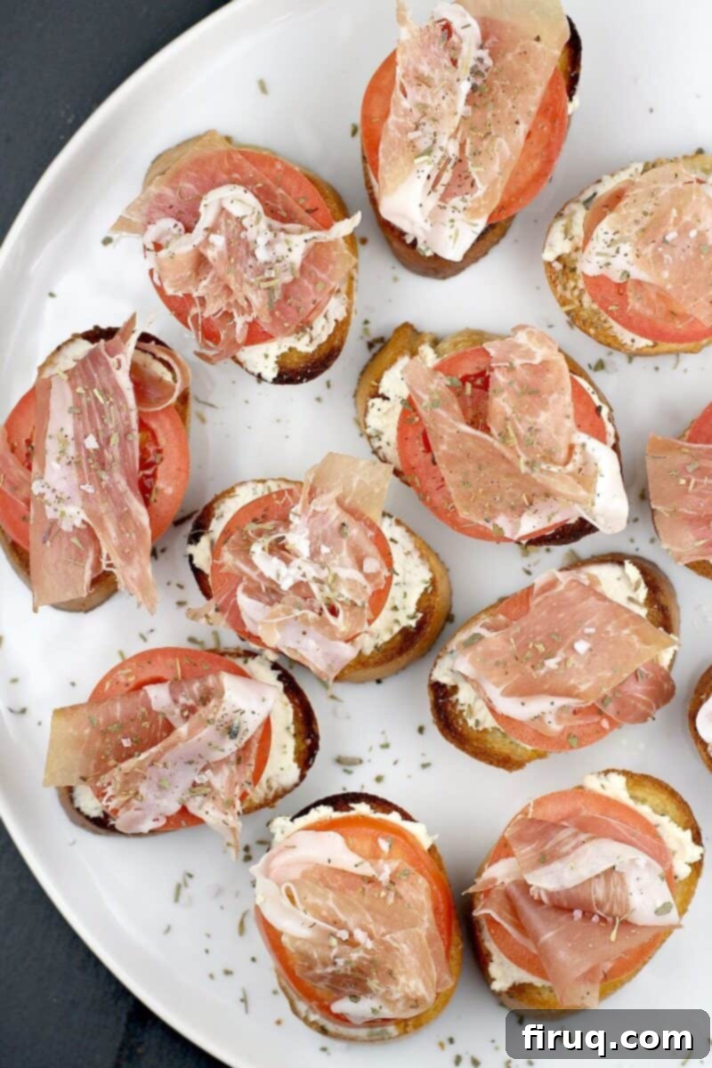 Crispy Prosciutto Crostini 13 numerous crostini on a white plate