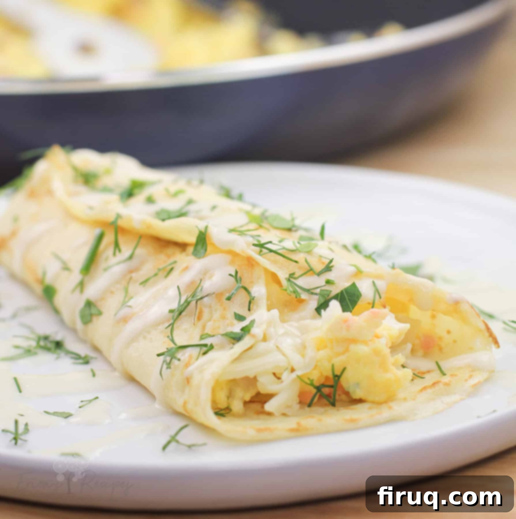 Silken Salmon Crepe Embrace 15 close view of prepared serving of crepe on white dish