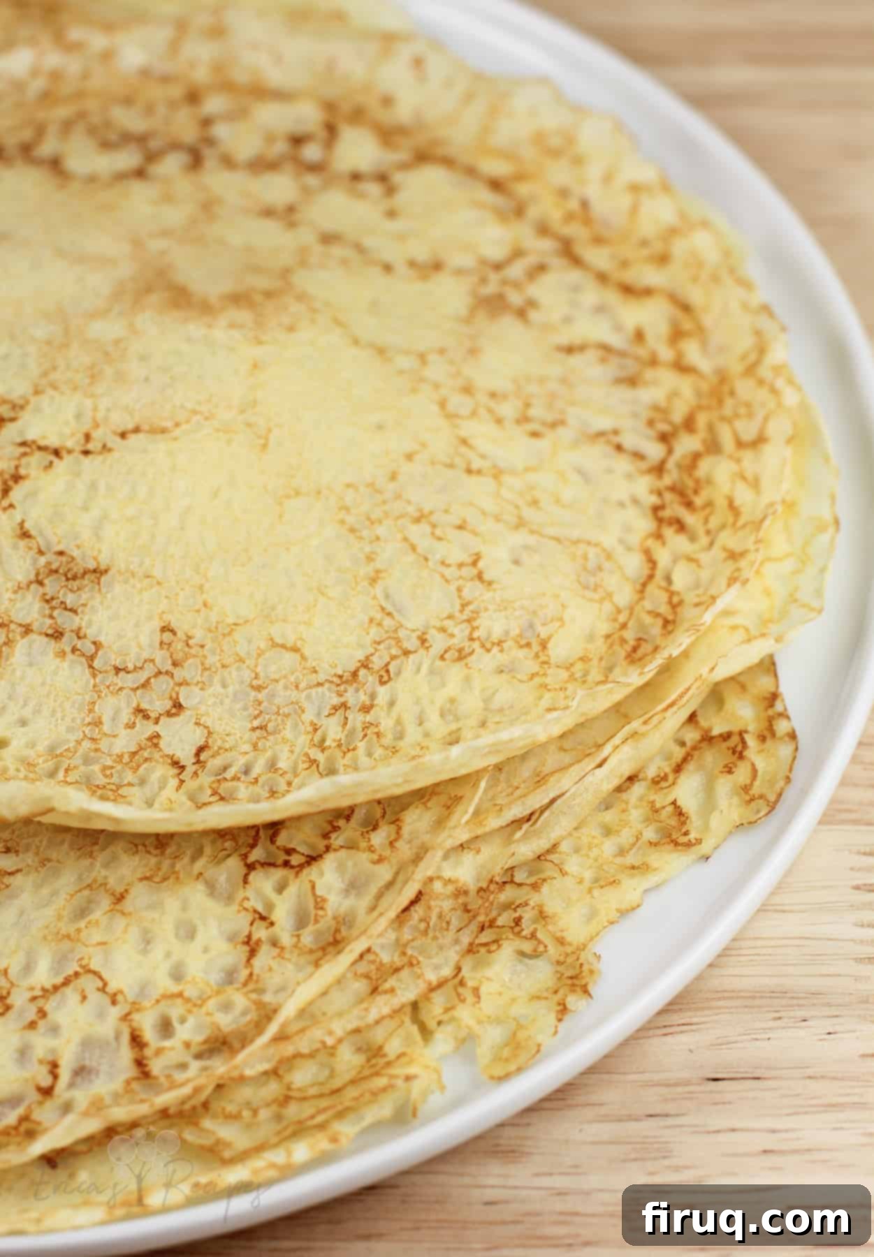 Silken Salmon Crepe Embrace 4 crepes stacked on white dish