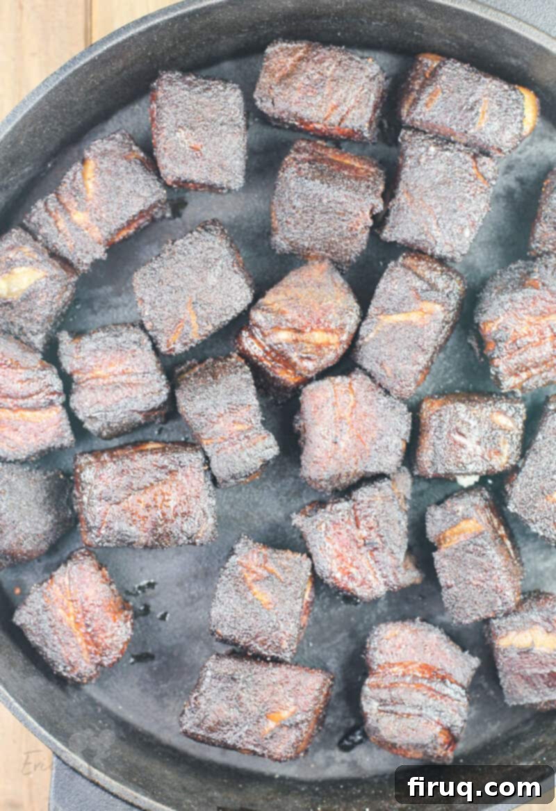 Smoky Glazed Pork Belly Bites 11 Smoked pork belly pieces in a pan before the glazing process begins