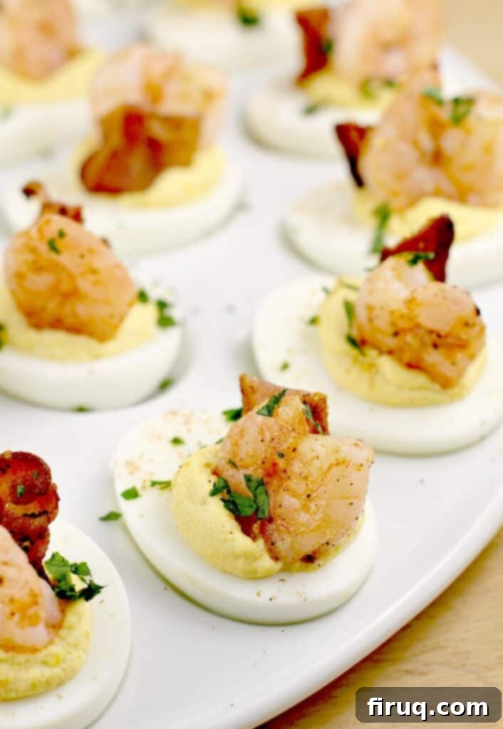 Zesty Stuffed Eggs 5 fully assembled shrimp deviled eggs on a white platter
