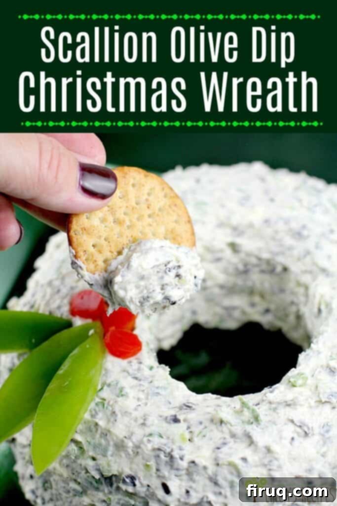 Festive Olive & Scallion Wreath Dip 16 A festive Scallion Olive Party Dip Christmas wreath, beautifully garnished with red and green bell peppers, sitting on a serving plate ready for guests.