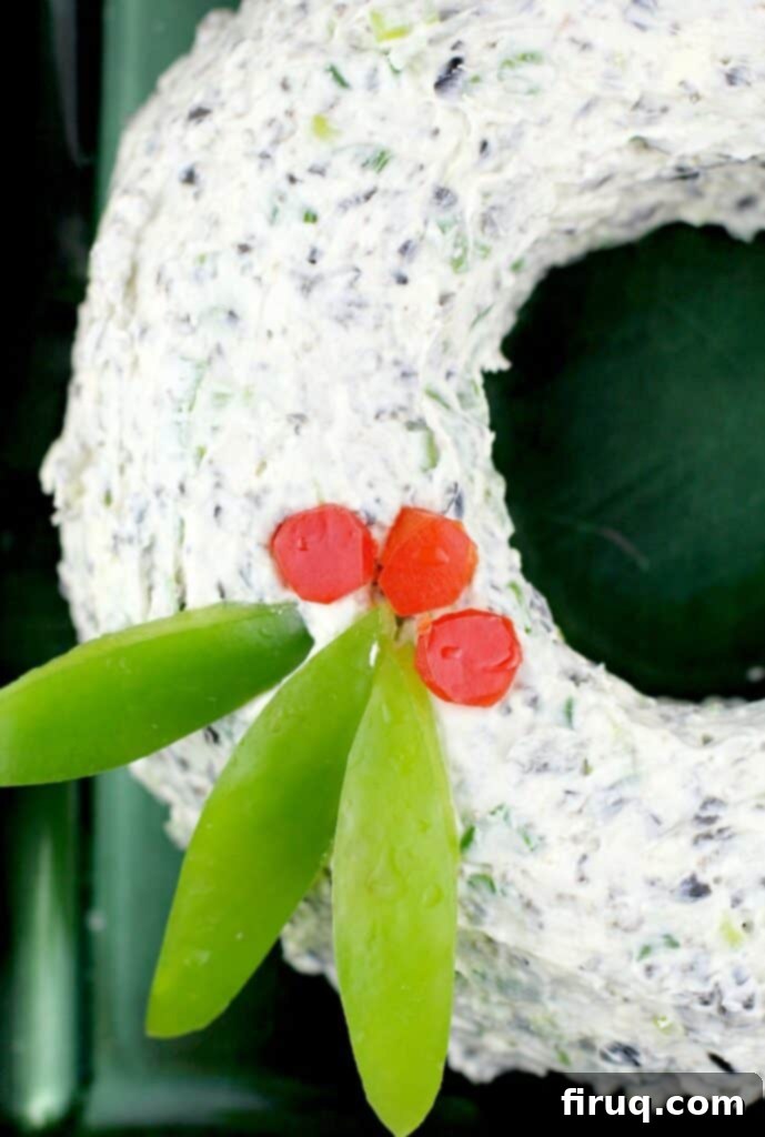Festive Olive & Scallion Wreath Dip 3 Close-up side view of the festive Scallion Olive Party Dip cheese wreath, highlighting the texture and colorful bell pepper garnish.