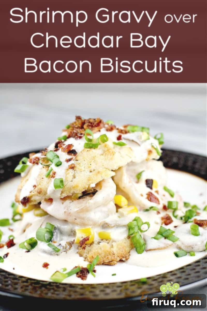 Cheddar Bay Bacon Biscuits Smothered in Shrimp Gravy 9 image for sharing on social media with finished shrimp gravy and bacon biscuits on plate; text overly of recipe title