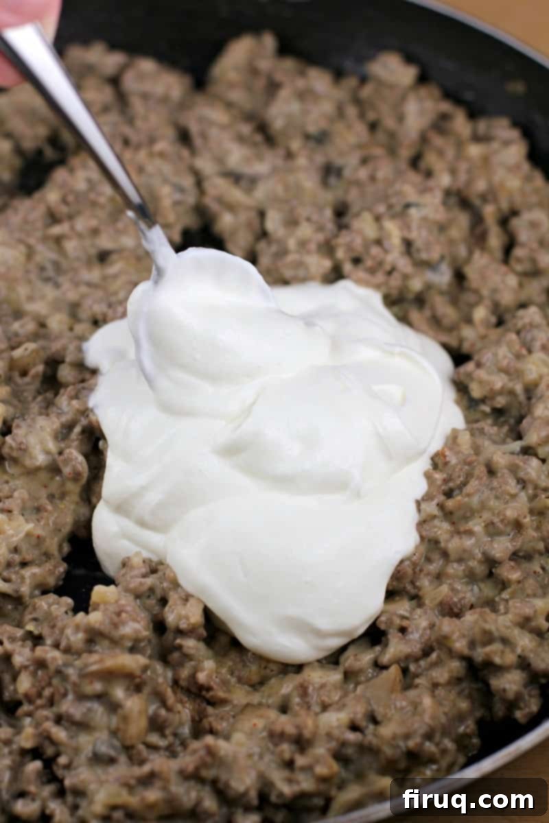 Gourmet Beef Stroganoff Crepes 5 sour cream on ground beef