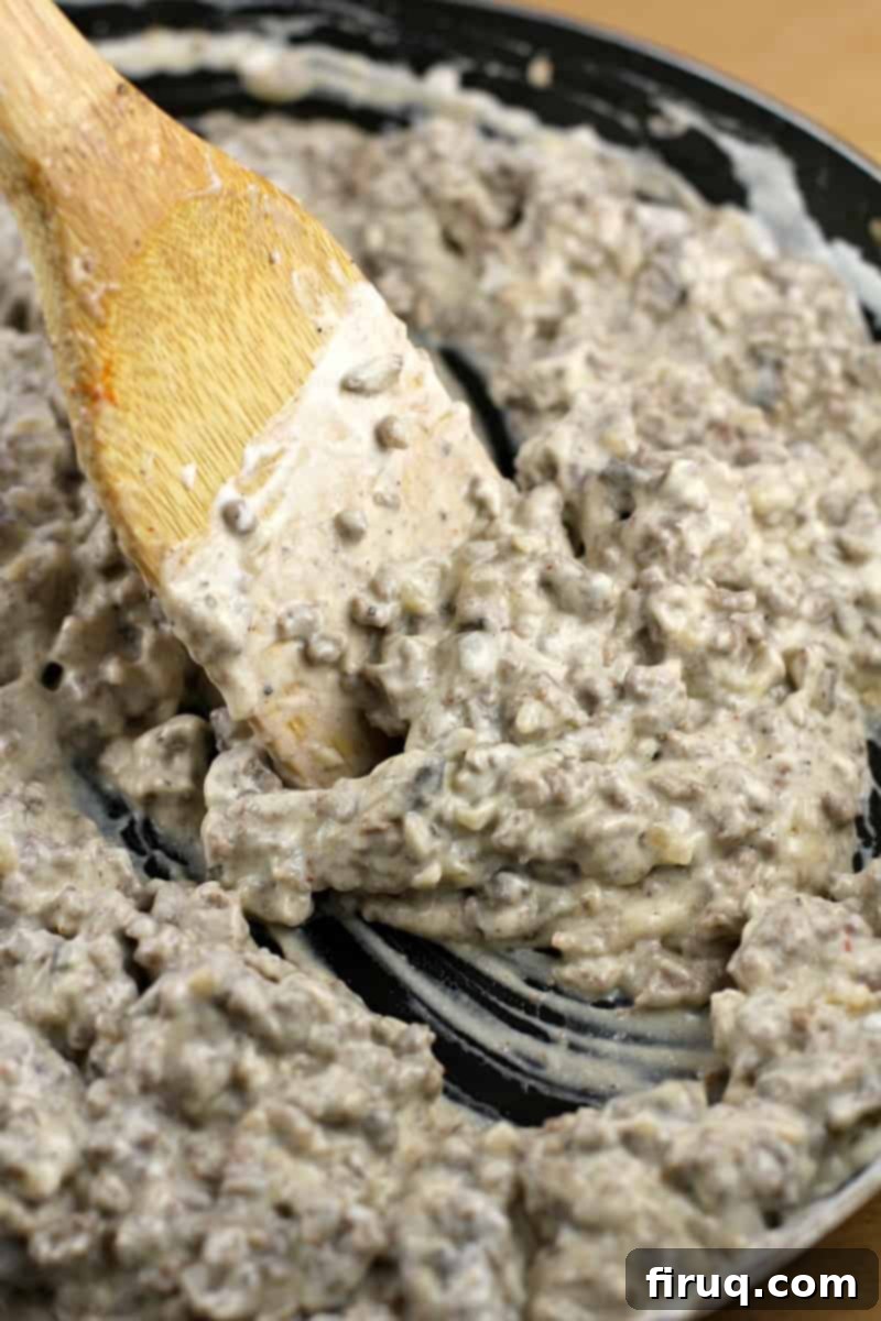 Gourmet Beef Stroganoff Crepes 6 wooden spatula stirring stroganoff