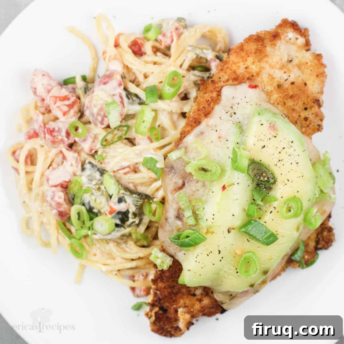 Baja Chicken Parmesan 13 Mexicali chicken parmesan with spicy alfredo sauce pasta on white plate