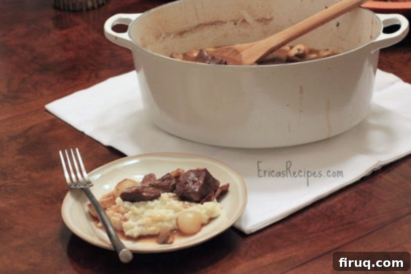 The Julia Child Boeuf Bourguignon 11 Julia Child's Boeuf Bourguignon simmering, showing the natural signs of a well-used pot