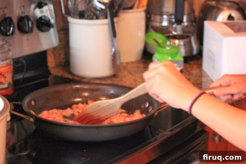 The Julia Child Boeuf Bourguignon 3 Daughter assisting in browning bacon for Boeuf Bourguignon