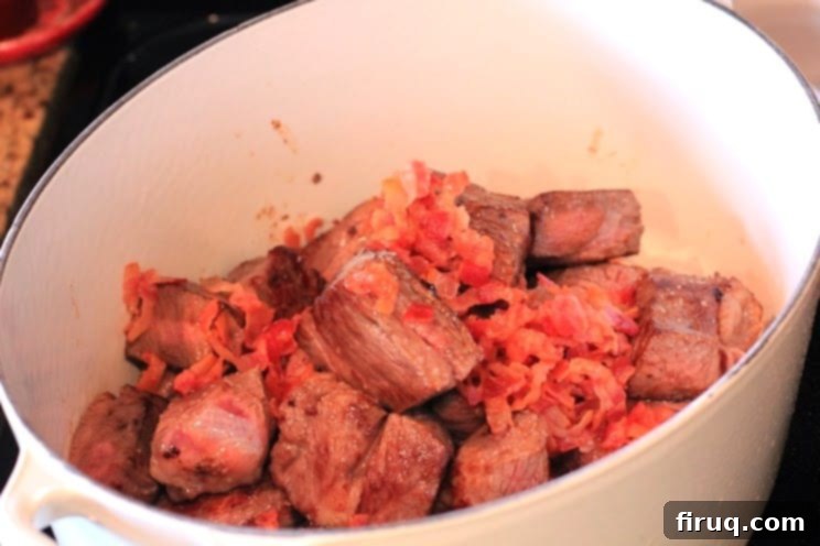 The Julia Child Boeuf Bourguignon 5 Close-up of beef chunks browning in the pan with bacon fat
