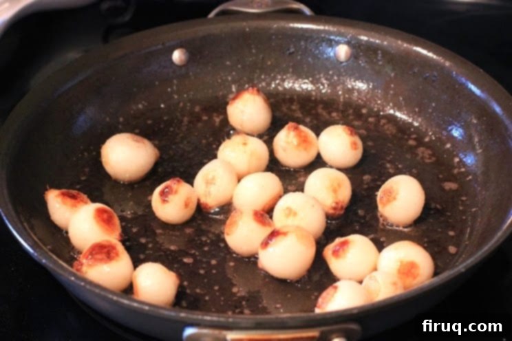 The Julia Child Boeuf Bourguignon 9 Pearl onions braising gently in chicken stock for Boeuf Bourguignon