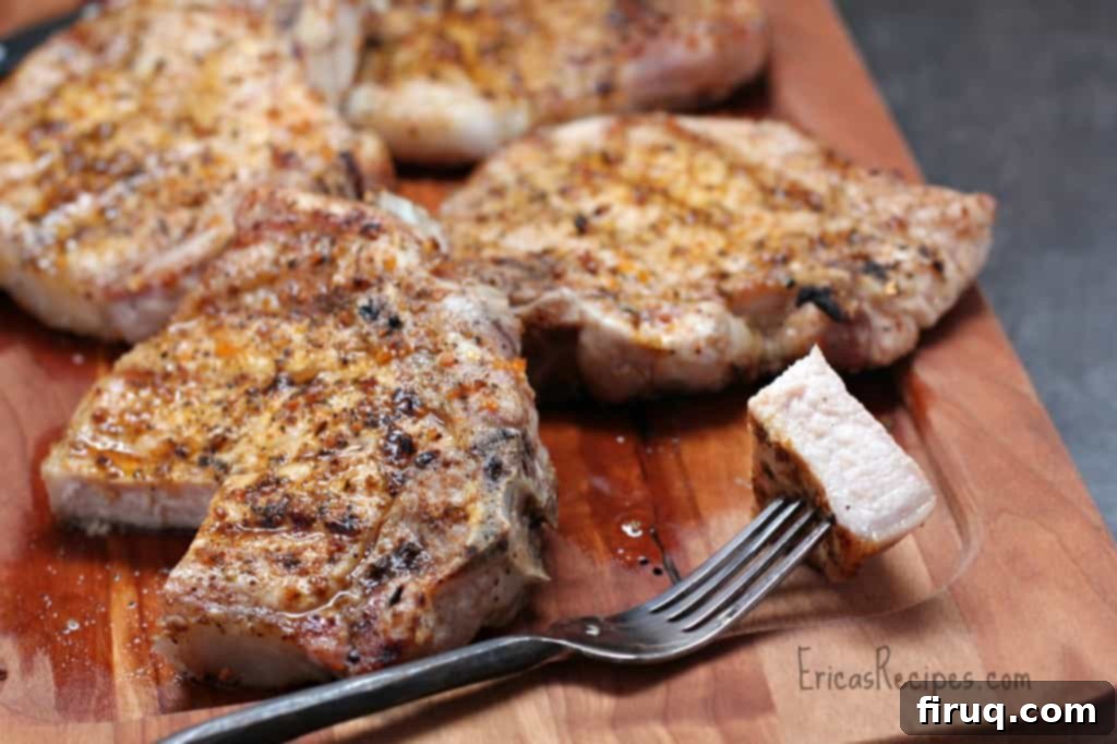 The Ultimate Grilled Pork Chops 4 Grilled pork chops resting on a cutting board, preserving their juices