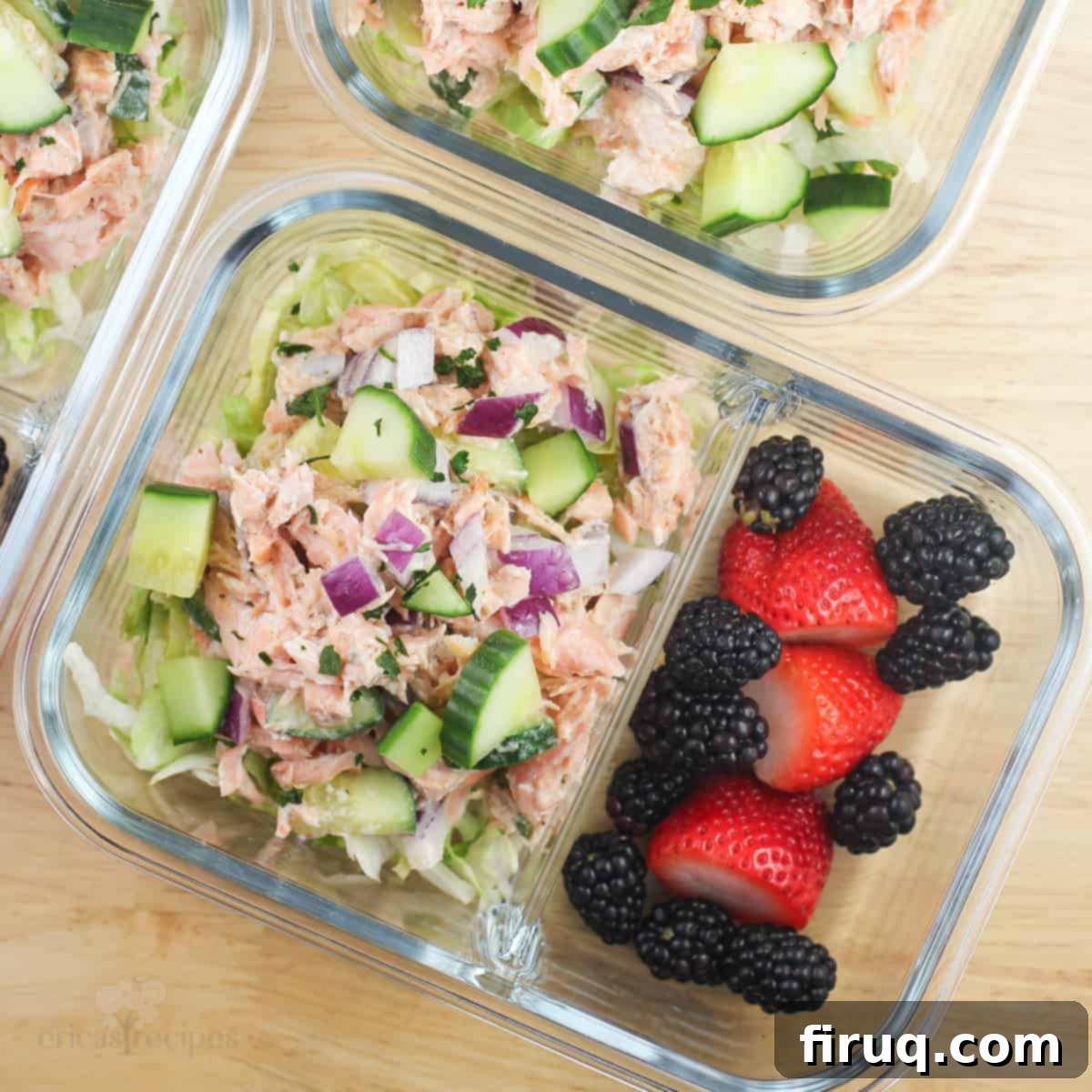 Meal Prep Salmon Salad 8 divided glass container with salmon salad in one section, berries in the other