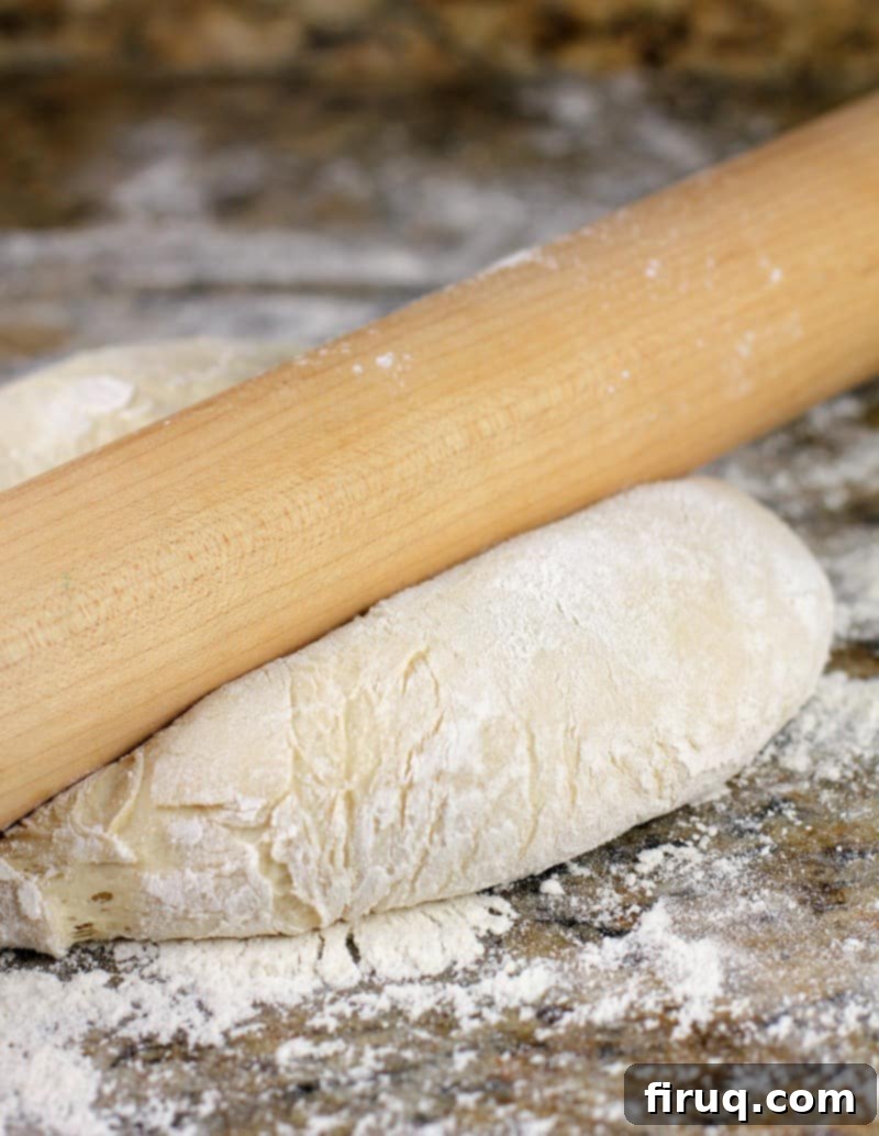 Sam Adams Hoppy Pizza Crust 10 rolling pin pressing on pizza dough