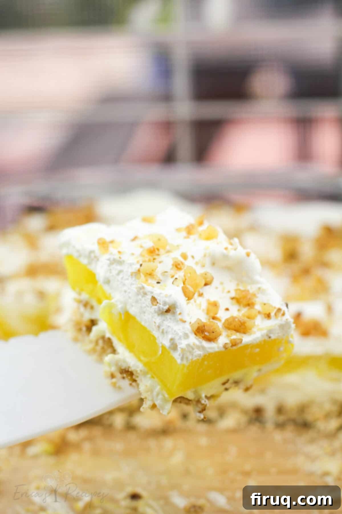 Zesty Lemon Bliss 7 white pie server holding up portion of lemon delight