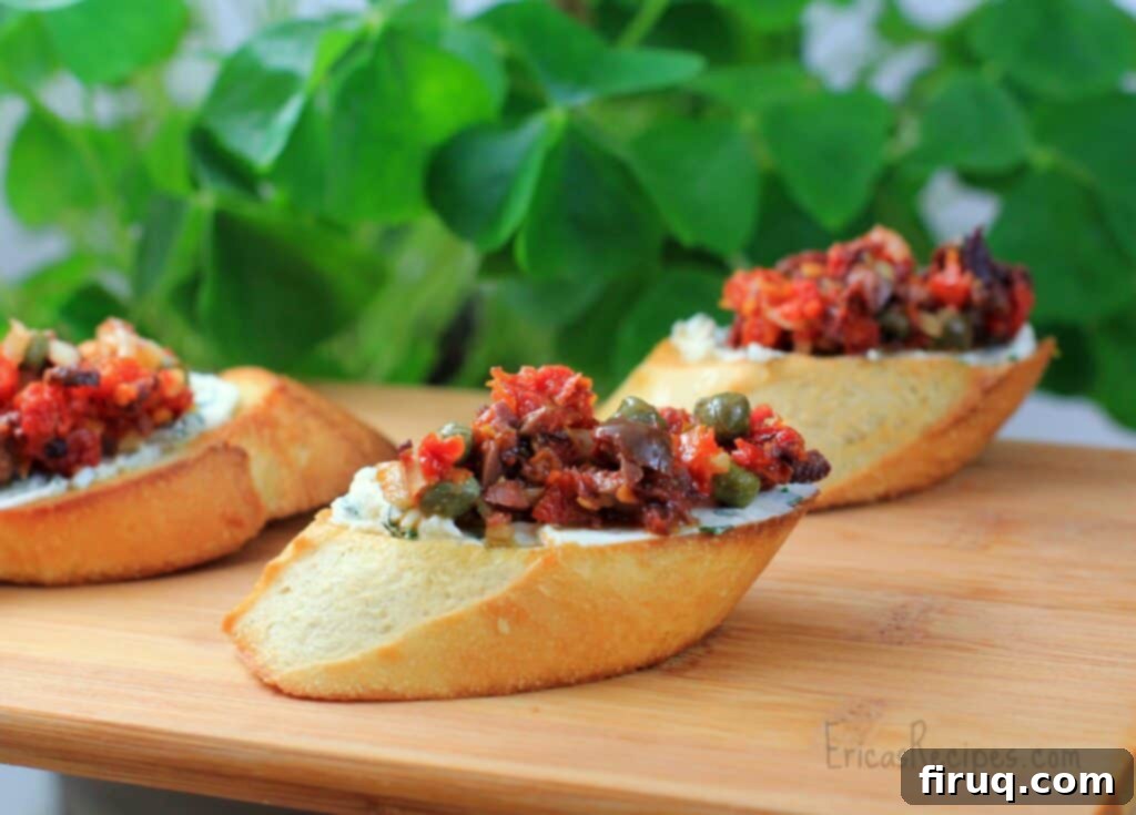 Sun-Kissed Tomato Tapenade and Herbed Goat Cheese Crostini 2 Crostini with Sun-Dried Tomato Tapenade and Herbed Goat Cheese