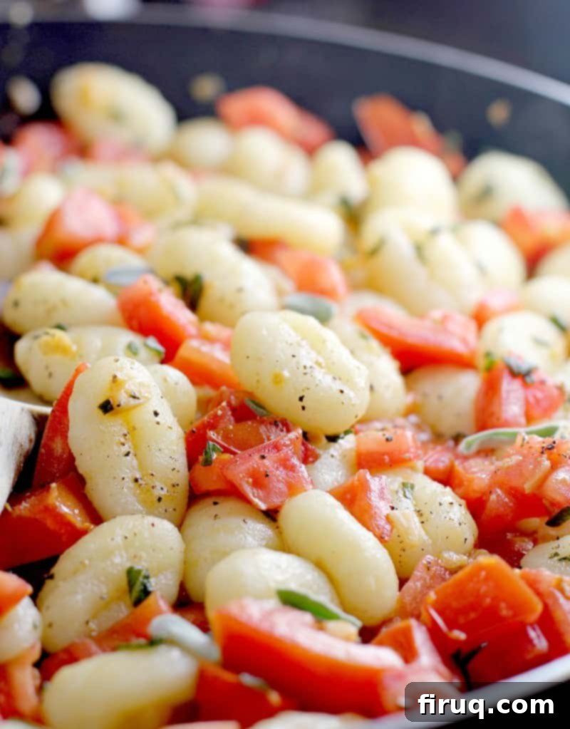 Gnocchi with Vine-Ripened Tomato, Parmesan, and Olive Oil 6 Gnocchi cooking in a skillet with the sauce.