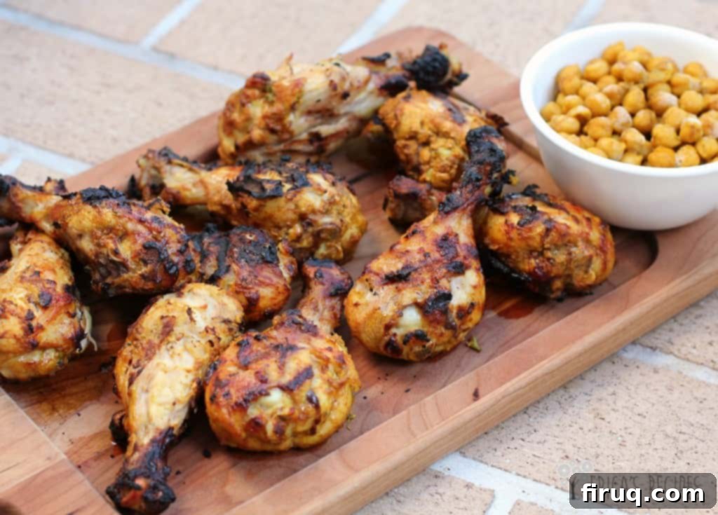 Grilled Tandoori Chicken with Spiced Chickpeas Your Weekly Budget Favorite 2 Grilled Tandoori Chicken with Spiced Chickpeas on a serving platter