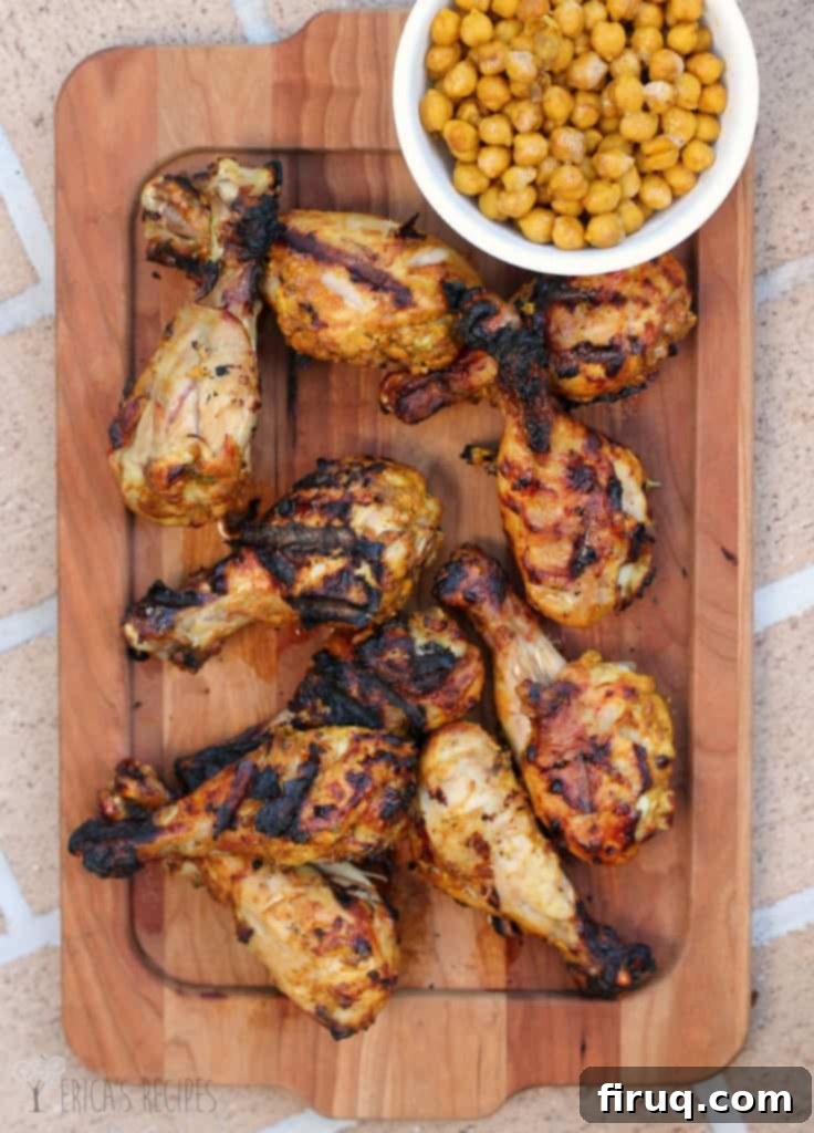 Grilled Tandoori Chicken with Spiced Chickpeas Your Weekly Budget Favorite 3 Close-up of grilled Tandoori chicken leg