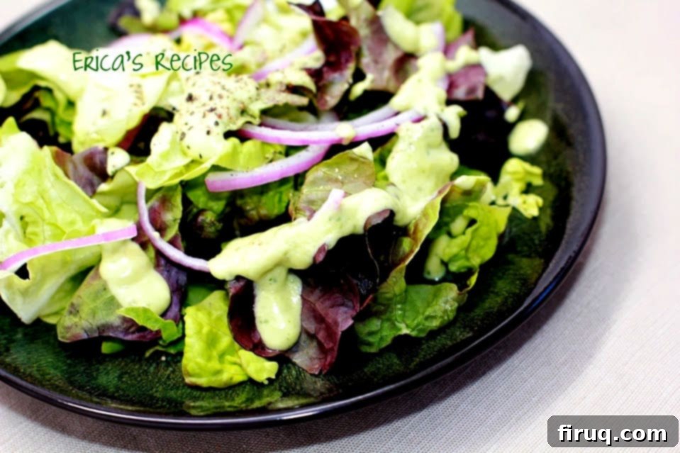 Fresh Herb Avocado Elixir 4 Avocado Herb Dressing - Avocado Herb Dressing in a serving bowl with a spoon