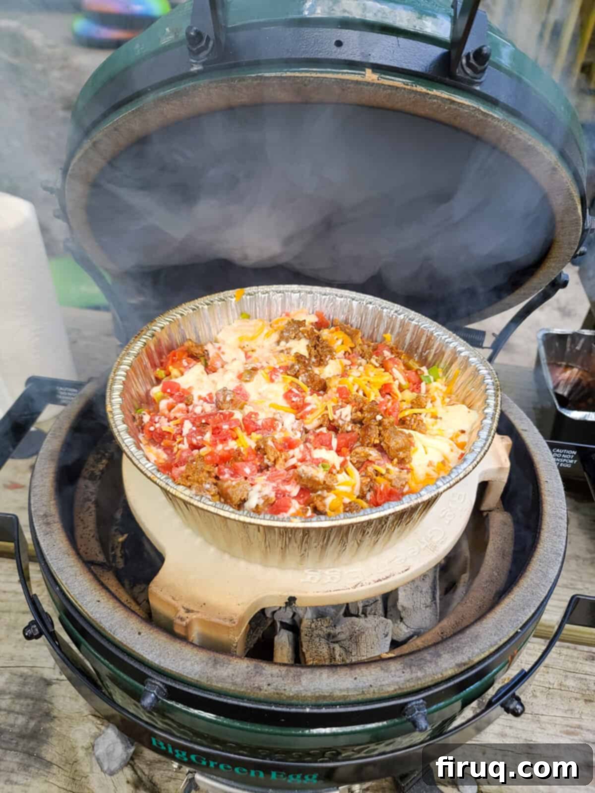 Velvet Smoked Queso 3 open big green egg with queso smoking on plate setter
