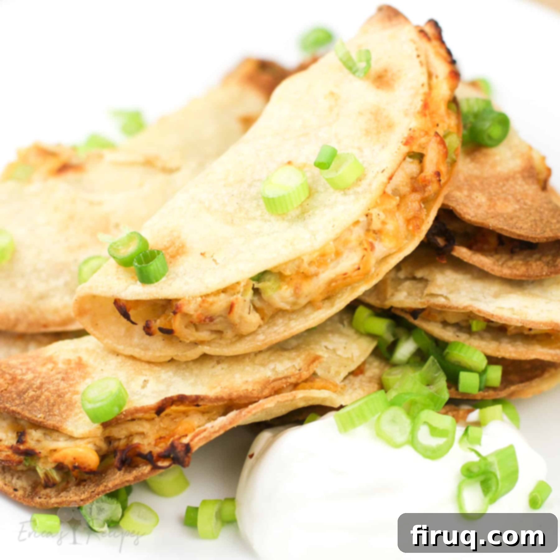 Crispy Mini Air Fryer Chicken Quesadilla 8 mini chicken quesadilla on white plate