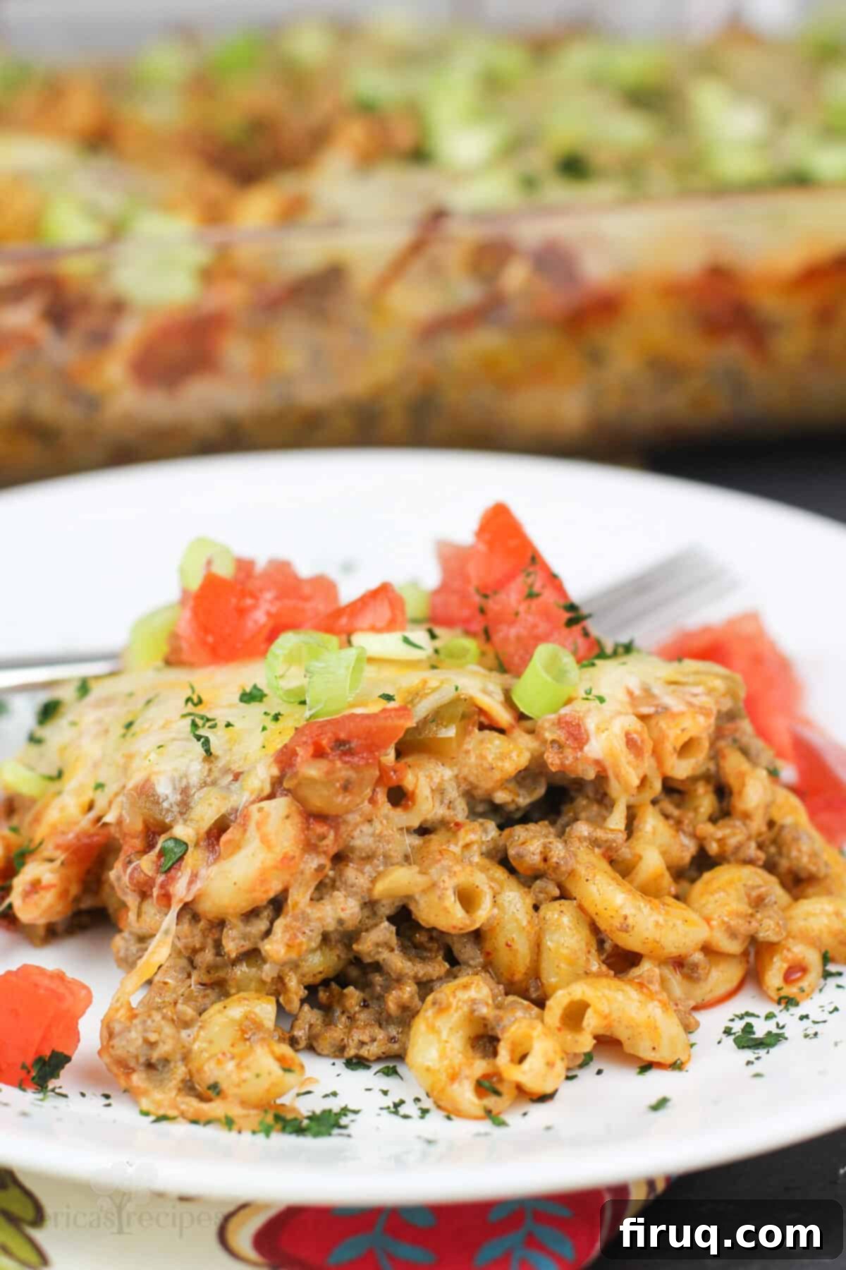 Southwest Mac & Beef Casserole 7 plated recipe on white dish with casserole in background