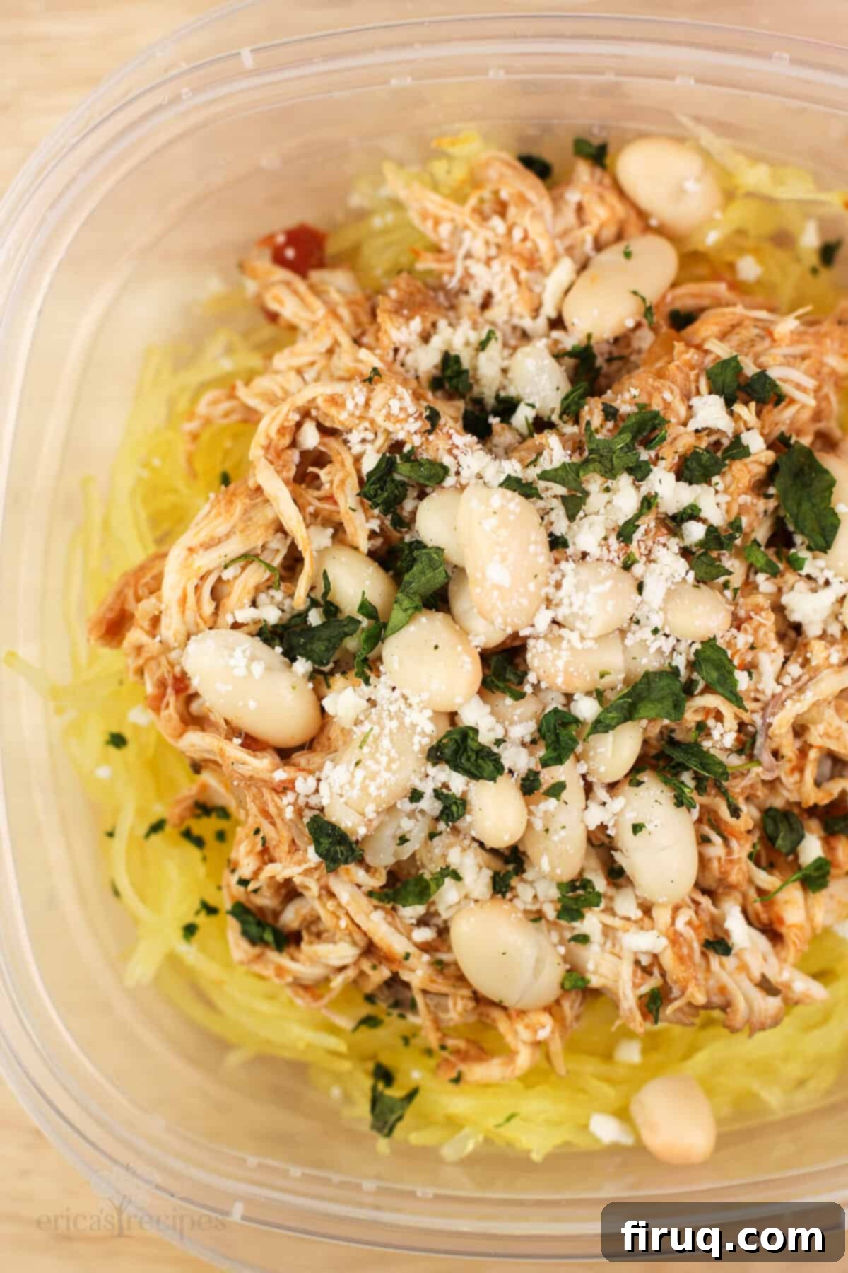 Zesty Chicken Pizzaiola Atop Spaghetti Squash Strands 3 top down view into plastic container with prepared chicken over spaghetti squash