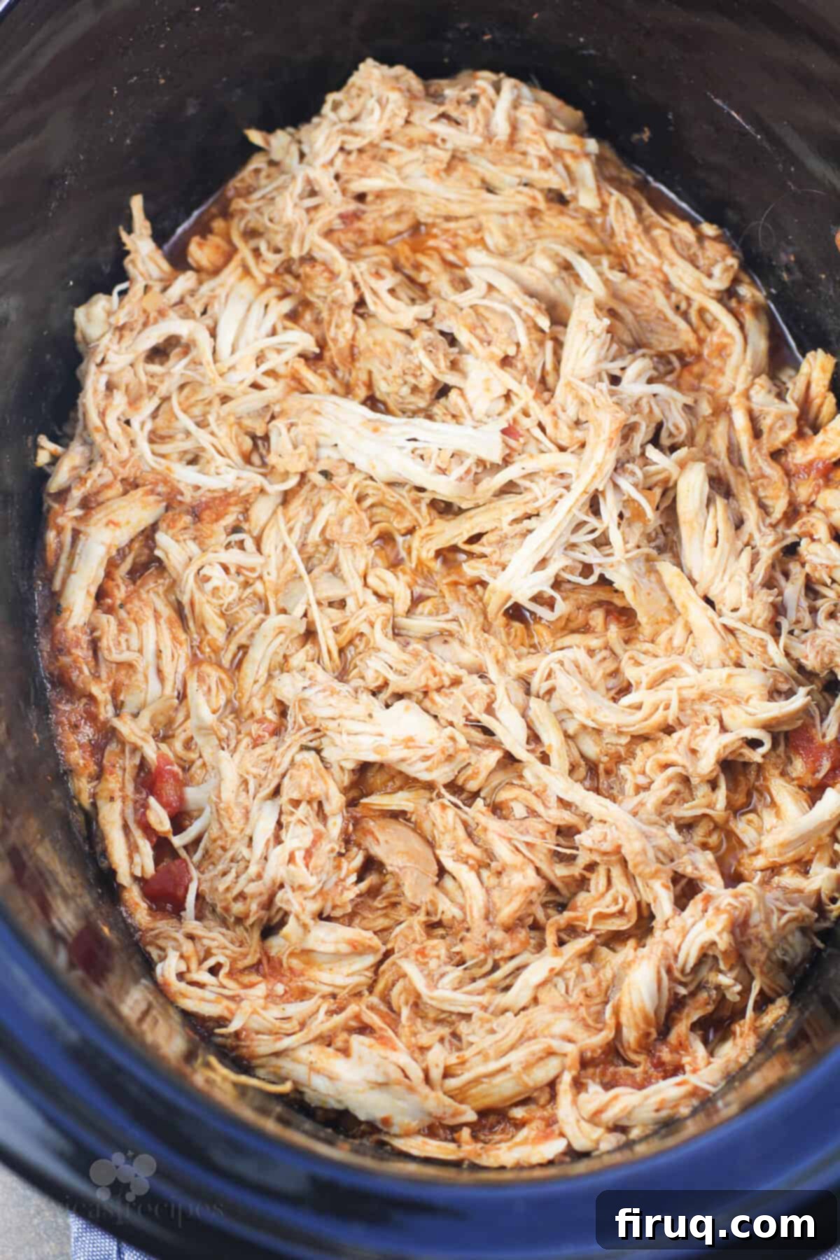 Zesty Chicken Pizzaiola Atop Spaghetti Squash Strands 5 shredded cooked chicken in black slow cooker