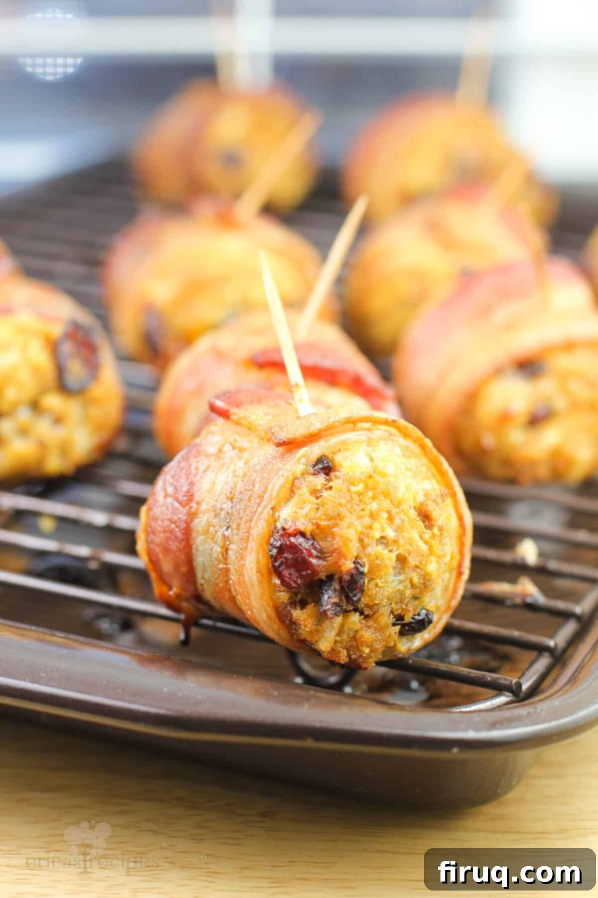 Crispy Bacon Stuffing Bites 2 cooked stuffing ball with toothpick inserted on grate, ready to be served