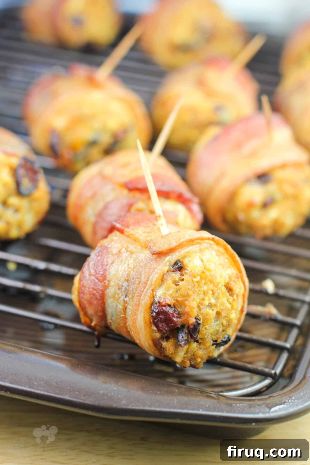 Crispy Bacon Stuffing Bites 6 cooked stuffing ball with toothpick inserted, on a serving platter