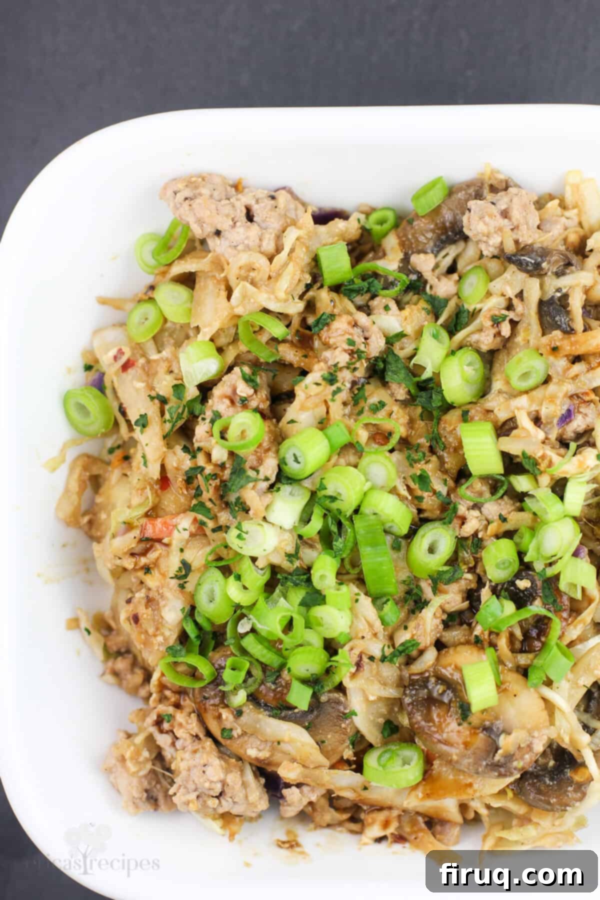 Blackstone Egg Roll Bowl 3 close view of prepared egg roll in a bowl, showing the mix of vegetables, pork, and sauce