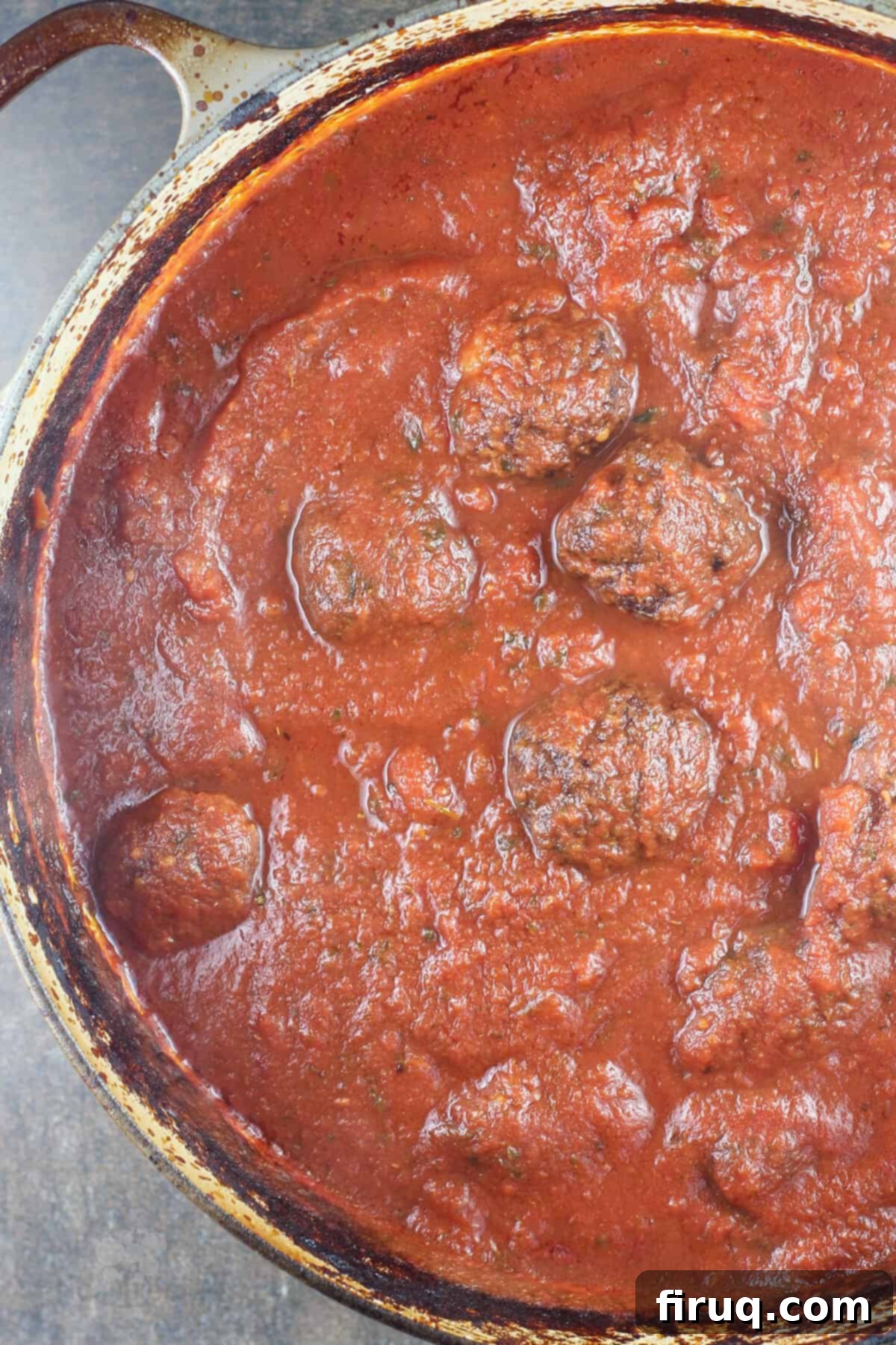 Smoky Meatballs in Tangy Marinara 11 cooked meatballs in sauce in dutch oven