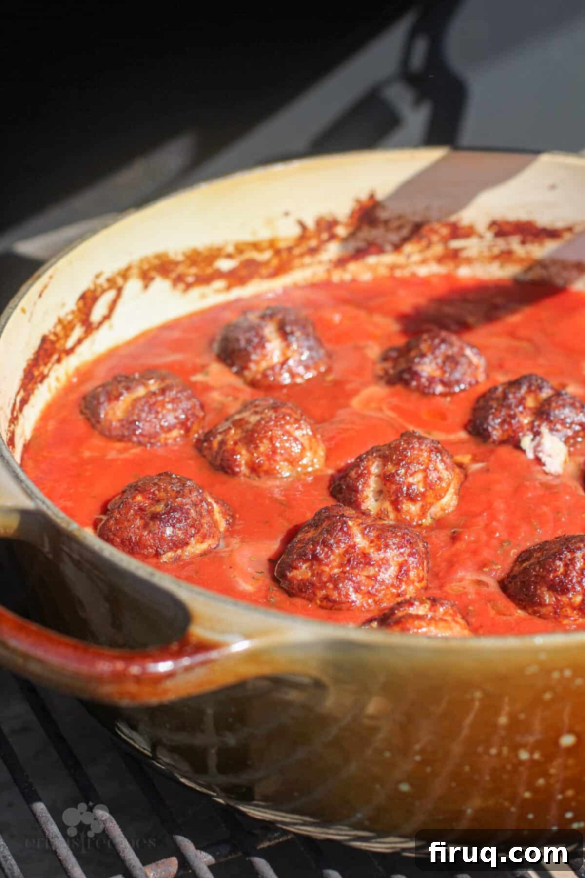 Smoky Meatballs in Tangy Marinara 8 cooked meatballs in sauce (outdoor view)