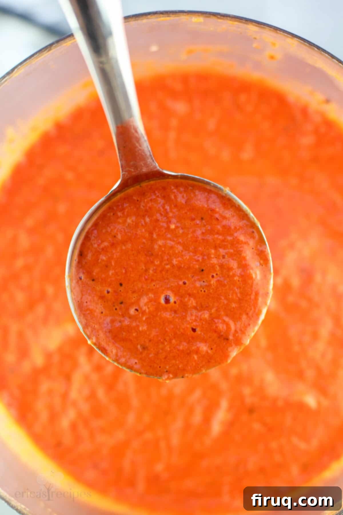 Roasted Red Pepper Coulis 11 ladle holding sauce